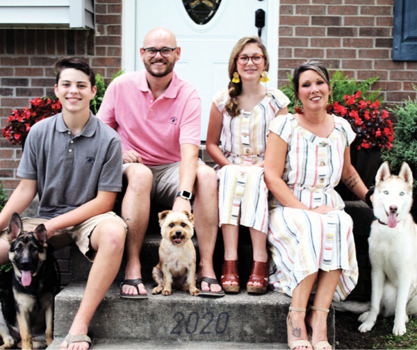 Fordsville Administrator Josh Strasburger pictured with family two children boy and girl and wife