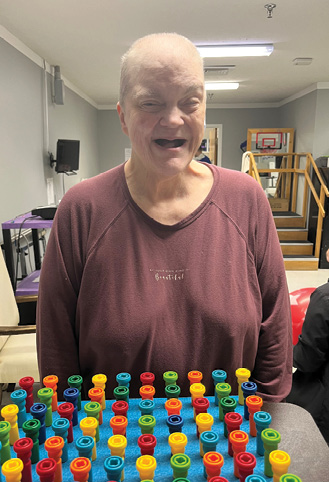 Older adult woman, smiling for photo. Resident of Fordsville Nursing and Rehabilitation